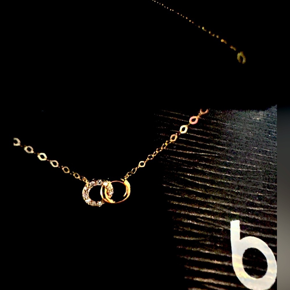 GOLD Necklace with diamonds From Bloomingdales.NEVER USED or removed fr the box